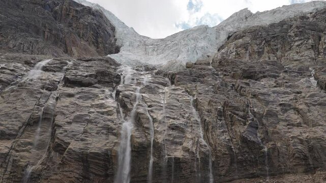 A majestic glacier with cascading waterfalls on Mount Edith Cavell, Canadian Rockies