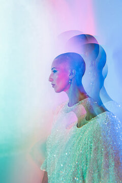 Creative portrait of bald woman with colorful light effects