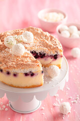 Tasty coconut cheesecake made with mascarpone and chokeberries.