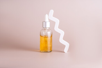 Cosmetic skincare product with zigzag decor on beige background