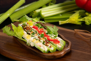 Stuffed celery sticks with soft cream and vegetables