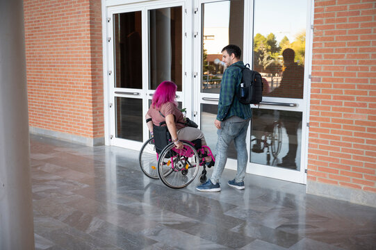 College couple with wheelchair navigating campus life together