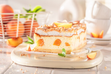 Tasty peach cheesecake made with cocoa and peaches.