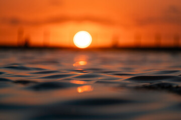 Warm summer sunrise view from the ocean.