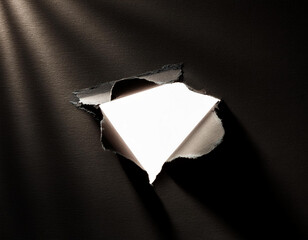 Torn Black Paper Reveals White Background, Abstract Texture