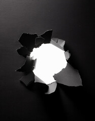 Torn Black Paper Reveals White Background, Abstract Texture