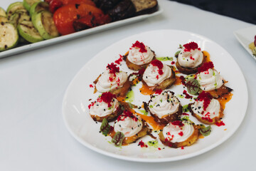 Catering table, beautifully decorated banquet with variety different food snacks appetizers on christmas corporate birthday party event or wedding celebration, canape, salad, delicatessen setting