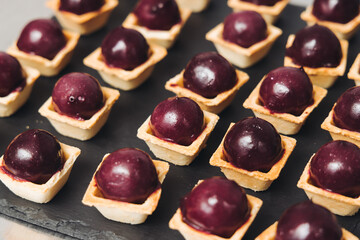 Catering table, beautifully decorated banquet with variety different food snacks appetizers on christmas corporate birthday party event or wedding celebration, canape, salad, delicatessen setting
