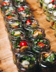 Catering table, beautifully decorated banquet with variety different food snacks appetizers on christmas corporate birthday party event or wedding celebration, canape, salad, delicatessen setting