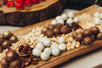 Catering table, beautifully decorated banquet with variety different food snacks appetizers on christmas corporate birthday party event or wedding celebration, canape, salad, delicatessen setting