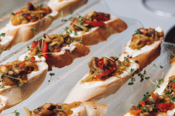 Catering table, beautifully decorated banquet with variety different food snacks appetizers on christmas corporate birthday party event or wedding celebration, canape, salad, delicatessen setting