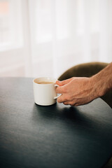 cup of latte on wooden table