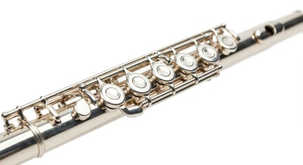 Obraz premium Silver flute close-up on white background showcasing detailed keys and metalwork