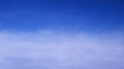 Obraz premium Serene Blue Sky with Soft White Clouds in Bright Daylight