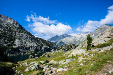 Young hiker woman in Vall de Boi, Aiguestortes and Sant Maurici National Park, Spain