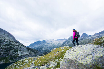 Young hiker woman in Vall de Boi, Aiguestortes and Sant Maurici National Park, Spain