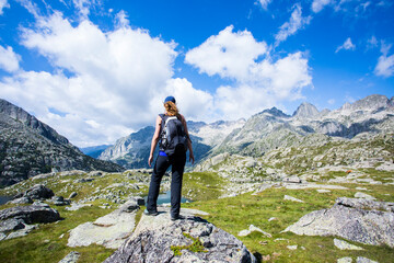 Young hiker woman in Vall de Boi, Aiguestortes and Sant Maurici National Park, Spain