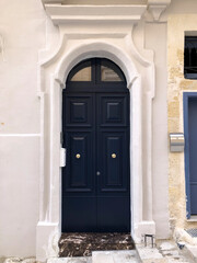Sophisticated Black Maltese Wooden Door - A sleek black wooden door from Malta, blending traditional craftsmanship with a bold and sophisticated design