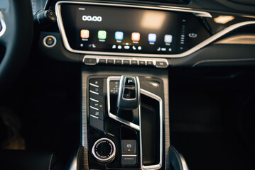 Obraz premium Automatic transmission gear with leather of luxury car. Black interior with chrome details