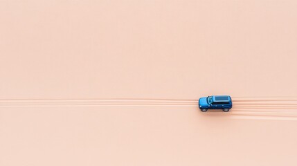 Aerial View of a Blue SUV Driving on Sandy Desert Terrain, Capturing the Essence of Adventure and Exploration in a Vast, Open Landscape with Dynamic Tire Tracks