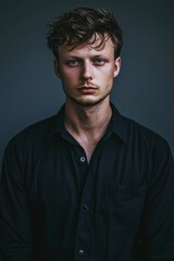 Obraz premium Young Man Portrait Wearing A Black Shirt