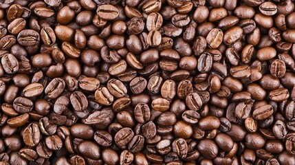 Fototapeta premium A close-up of roasted coffee beans, highlighting their rich texture and color.