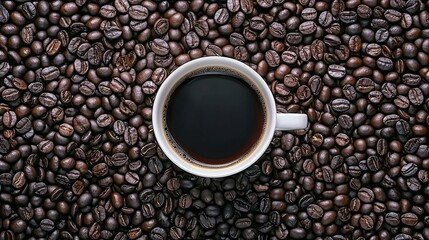 Fototapeta premium A cup of coffee surrounded by roasted coffee beans, highlighting the beverage's richness.