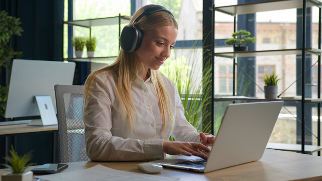 Caucasian woman working with business project online typing email on laptop at office smiling happy female businesswoman manager browsing internet computer e-commerce work studying cheerful girl smile