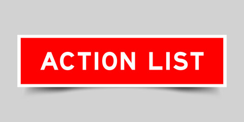 Red color square shape sticker label with word action list on gray background