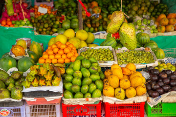Fruits and vegetables at a local market in Sri lanka. Tropical or exotic fruits on the street in Asia.