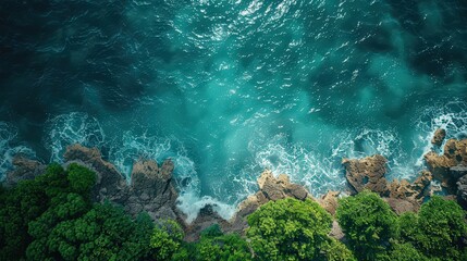 Obraz premium Beautiful top view of the landscape, Clear blue water of the ocean, waves crashing against the mountain,