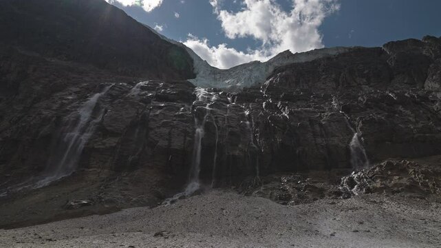 A serene glacial waterfall at Mount Edith Cavell in the Canadian Rockies, outdoors