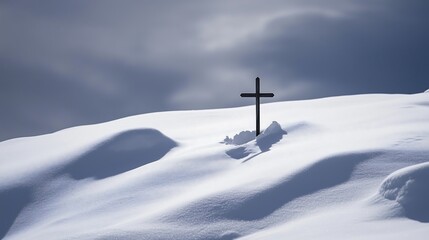 Fototapeta premium A wooden cross standing and covered in fresh snow, religious symbol, winter gray tone background
