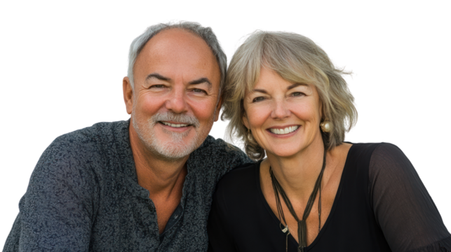 A joyful couple smiling at the camera, exuding warmth and happiness, set against a white isolated background.
