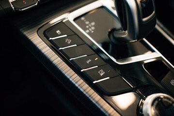 Automatic transmission gear with leather of luxury car. Black interior with chrome details