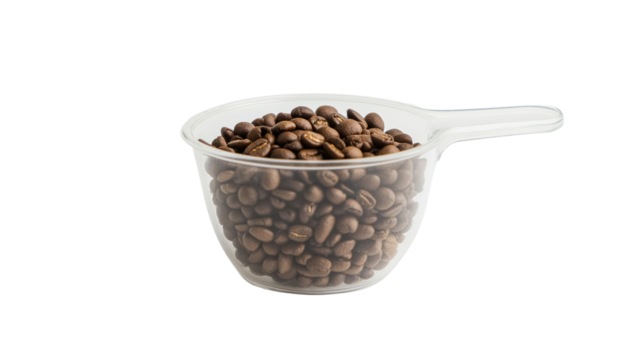 A transparent measuring cup filled with aromatic coffee beans, perfect for coffee lovers and culinary enthusiasts.