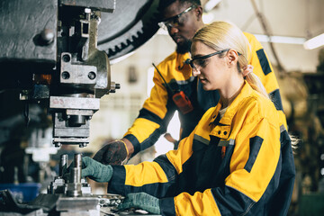 team working in heavy metal industry factory training inspector quality control in production line