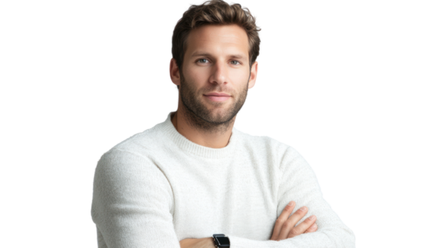 A young man with arms crossed, sporting a casual look in a white sweater, exuding confidence and approachability against a white isolated background.