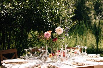 beautiful wedding decor. tables under the tree in the garden