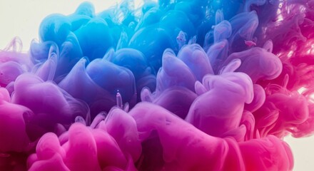 Fototapeta premium Vivid Ink Swirls in Water Creating a Stunning Abstract Design with Pink and Blue Hues