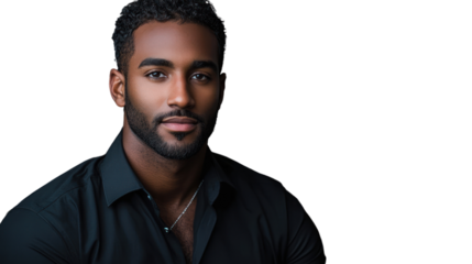 Portrait of a confident young man with a stylish short haircut, wearing a black shirt, presenting a relaxed expression against a neutral background.