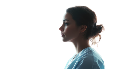 Profile view of a woman in medical attire with soft lighting, emphasizing her serene expression against a white isolated background.