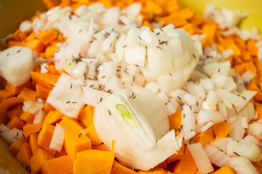 Pumpkin cubes and onion in spices. texture of diced pumpkin with onions and spices for filling pumpkin pie. High quality photo