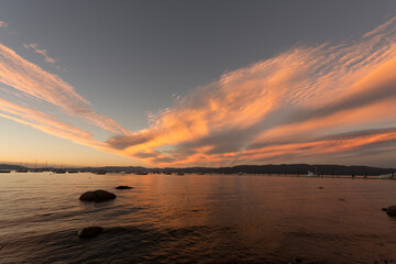 Beautiful Lake Tahoe sunset with red clouds reflected in the water