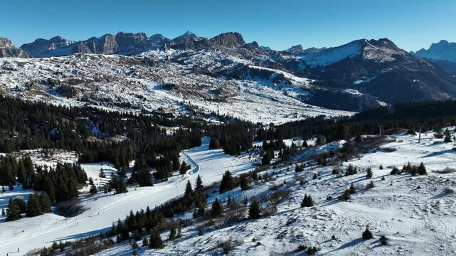 Sella Ronda group. Italian Dolomites drone aerial view in winter snow ski sunny days. Sella Ronda Marmolada .Aerial landscape of snowy Italian Alps Dolomites with Sella group in front and Marmolada.