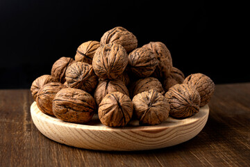 walnuts on a wooden plate