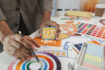 UI UX designers team working on new website wireframe in office, ux developer and ui designer use...
