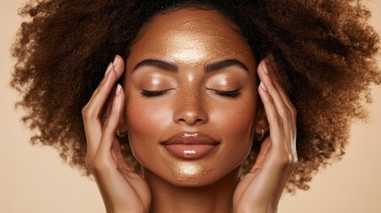 Obraz premium A radiant woman adorned with shimmering golden makeup, her face aglow with an ethereal light, embodies elegance and beauty in a mesmerizing display of artistry.
