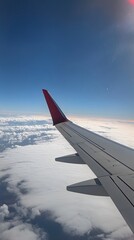Obraz premium Airplane Wing in Sky 