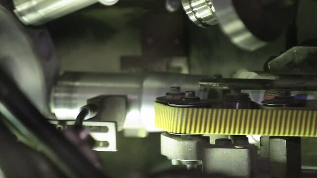 Labeling plastic food containers. High speed labeling machine in industrial factory. Machine for sticker on product in manufacture. Flexible packaging. Labeling machine in industrial factory.